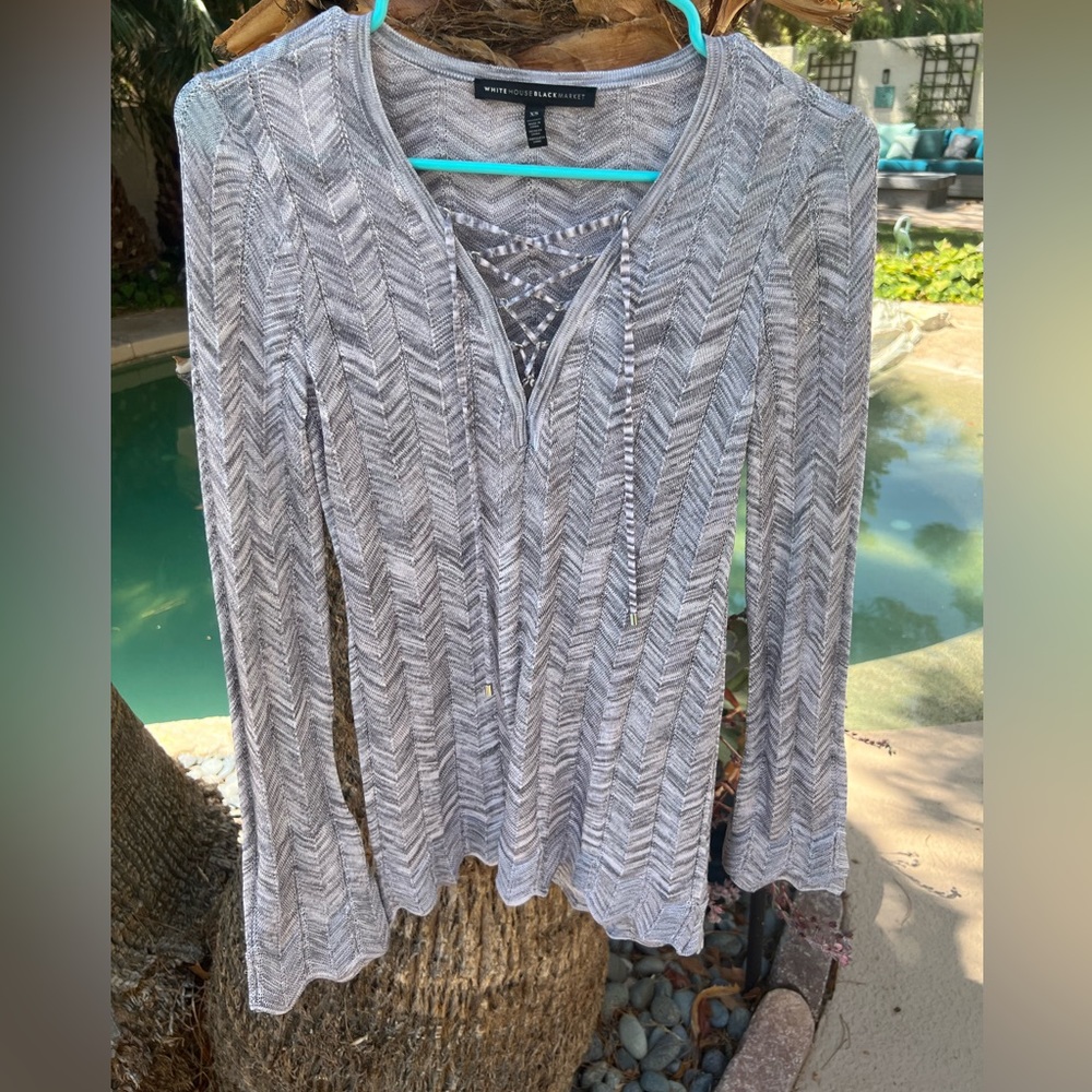 Soft double layered sleeved gray sweater top.